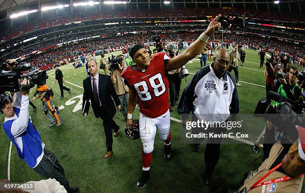 Tony Gonzalez of the Atlanta Falcons walks off the field after their 21-20 loss to the Carolina Panthers at Georgia Dome on December 29, 2013 in...