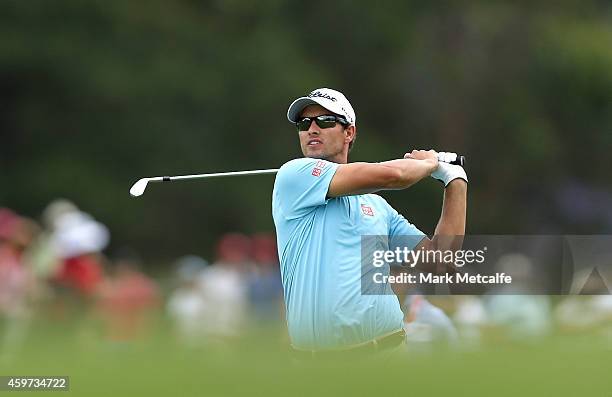 Adam Scott of Australia plays his second shot on the 18th hole during day four of the 2014 Australian Open at The Australian Golf Course on November...