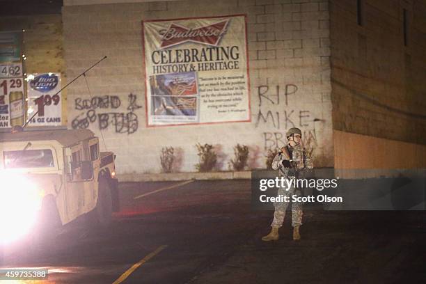 National guardsman stands watch along West Florissant Avenue on November 29, 2014 in Ferguson, Missouri. The Ferguson area has been struggling to...