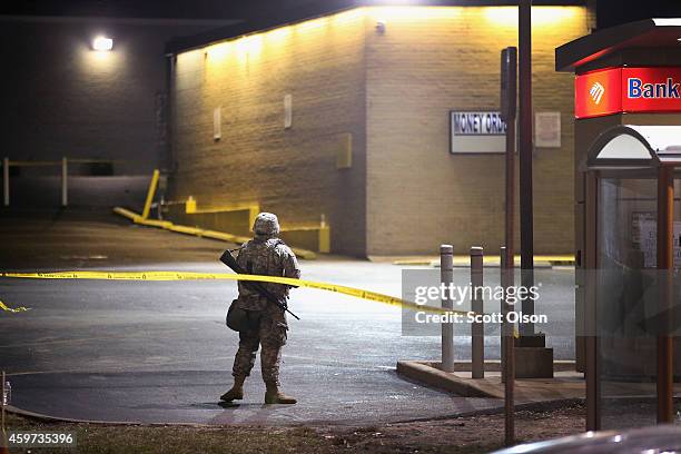 National guardsman stands watch along West Florissant Avenue on November 29, 2014 in Ferguson, Missouri. The Ferguson area has been struggling to...