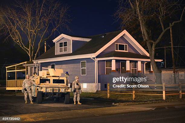 National gurardsmen stand guard near the police station on November 29, 2014 in Ferguson, Missouri. The Ferguson area has been struggling to return...