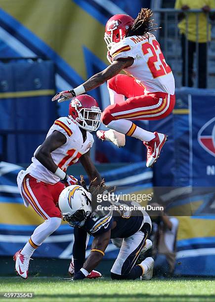 Wide receiver Dexter McCluster of the Kansas City Chiefs jumps over safety Jahleel Addae of the San Diego Chargers at Qualcomm Stadium on December...