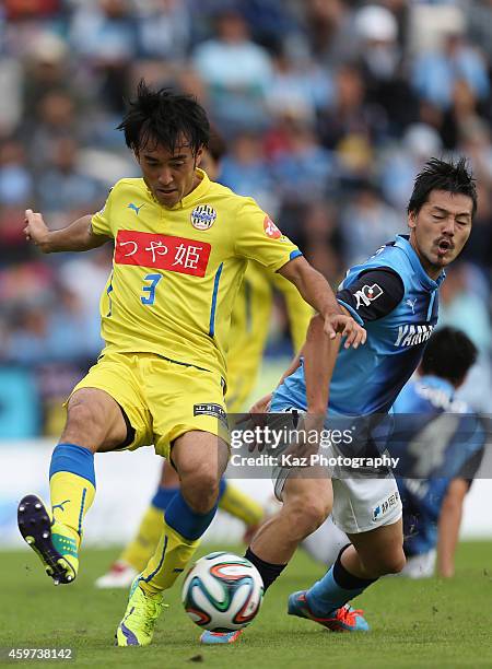 Hidenori Ishii of Montedio Yamagata and Daisuke Matsui of Jubilo Iwata compete for the ball during the J1 Promotion Play-off semi-final match between...