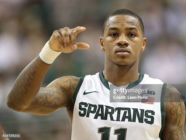 Keith Appling of the Michigan State Spartans brings the ball up the court during the second half of the game against the New Orleans Privateers at...