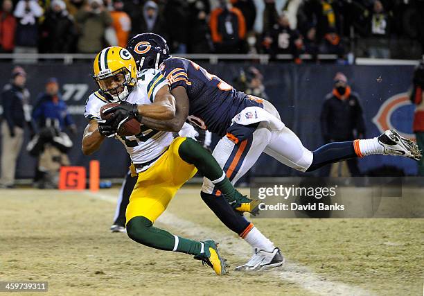 Randall Cobb of the Green Bay Packers catches the game winning catch during the fourth quarter as Zack Bowman of the Chicago Bears defends him on...