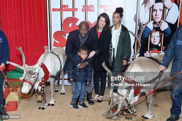 David Gyasi, Emma Gyasi and their children attend the UK Premiere of "Get Santa" at Vue West End on November 30, 2014 in London, England.