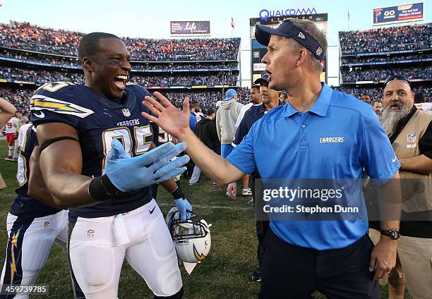 Head coach Mike McCoy and tight end Antonio Gates of the San Diego Chargers celebrate after the game against the Kansas City Chiefs at Qualcomm...