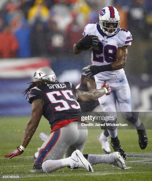 Spiller of the Buffalo Bills eludes a tackle by Brandon Spikes of the New England Patriots in the fourth quarter during the game at Gillette Stadium...