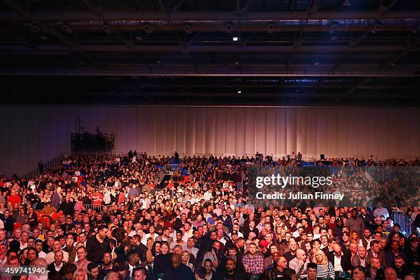 Fans watch on as Dereck Chisora of England fights Tyson Fury of England in the eliminator for the WBO World Heavyweight Championship during Boxing at...