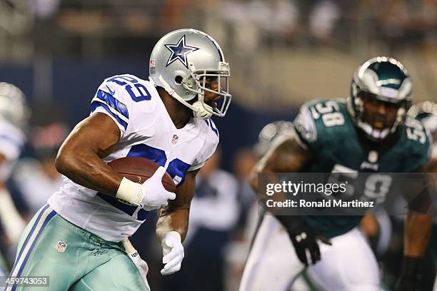 DeMarco Murray of the Dallas Cowboys carries the ball against DeMeco Ryans of the Philadelphia Eagles in the first half of their game at Cowboys...