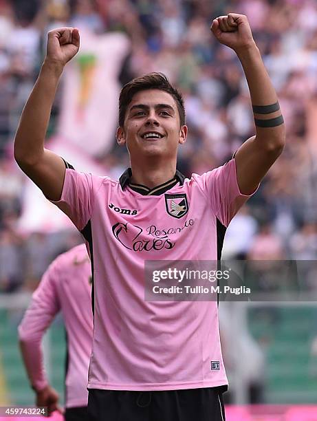 Paulo Dybala of Palermo celebrates after scoring the opening goal during the Serie A match between US Citta di Palermo and Parma FC at Stadio Renzo...
