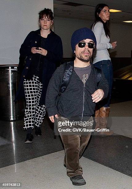 Peter Dinklage is seen at Los Angeles International Airport with his wife, Erica Schmidt on March 17, 2013 in Los Angeles, California.