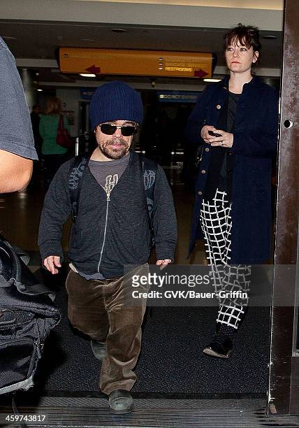 Peter Dinklage is seen at Los Angeles International Airport with his wife, Erica Schmidt on March 17, 2013 in Los Angeles, California.