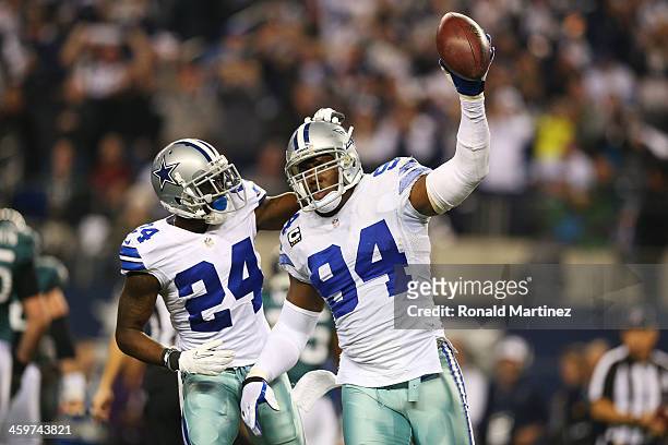 DeMarcus Ware and Morris Claiborne of the Dallas Cowboys celebrate in the second half against the Philadelphia Eagles at Cowboys Stadium on December...