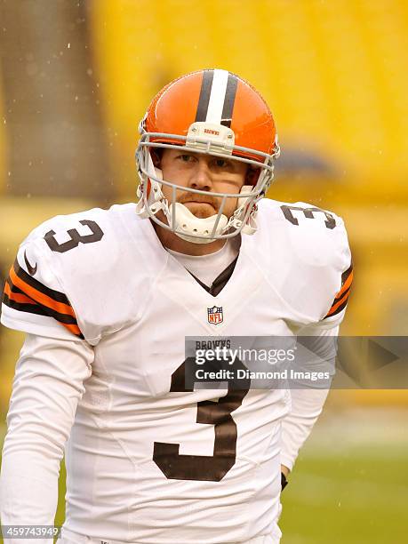 Quarterback Brandon Weeden of the Cleveland Browns walks onto the field prior to a game against the Pittsburgh Steelers on December 29, 2013 at Heinz...