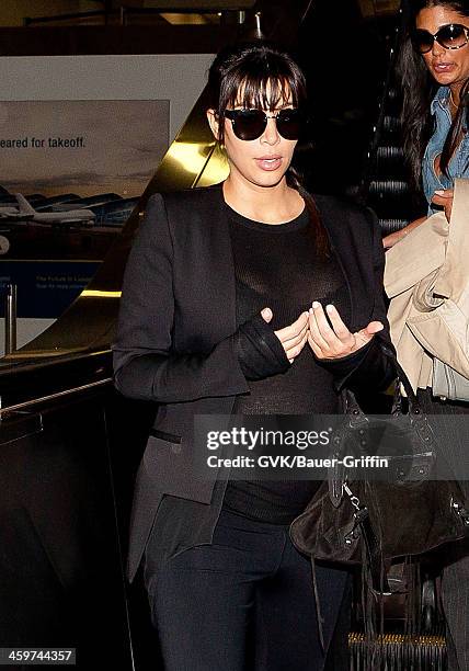 Kim Kardashian is seen at Los Angeles International Airport on March 17, 2013 in Los Angeles, California.