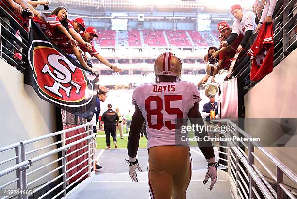 Tight end Vernon Davis of the San Francisco 49ers walks out onto the field before the NFL game against the Arizona Cardinals at the University of...