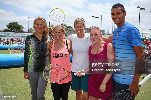 Tennis players Victoria Azarenka of Belarus and Nick Kyrgios of Australia pose with Australian sports stars Libby Trickett, Natalie Cook and Sally...