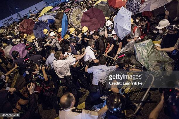 Pro-dRiot police clash with pro-democracy protesters outside Central Government Complex on November 30, 2014 in Hong Kong. According to reports,...