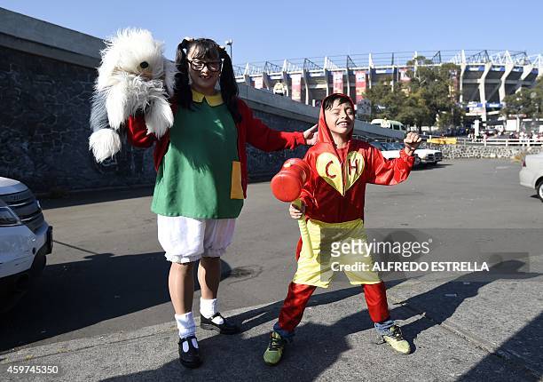 Girl dressed as "La Chilindrina" and a boy dressed as "El Chapulin Colorado", characters of the sitcoms "El Chavo del Ocho" and "El Chapulin...