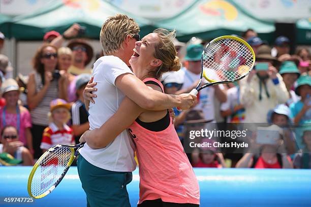 Australian sports stars Natalie Cook and Libby Trickett celebrate winning a point in mini tennis against Victoria Azarenka and Nick Kyrgios during...