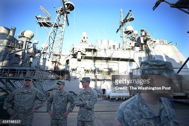 Joint Base Pearl Harbor-Hickam, Army personnel wait dockside to board the USS Lake Erie CG-70 a Ticonderoga class United States Navy guided missile...