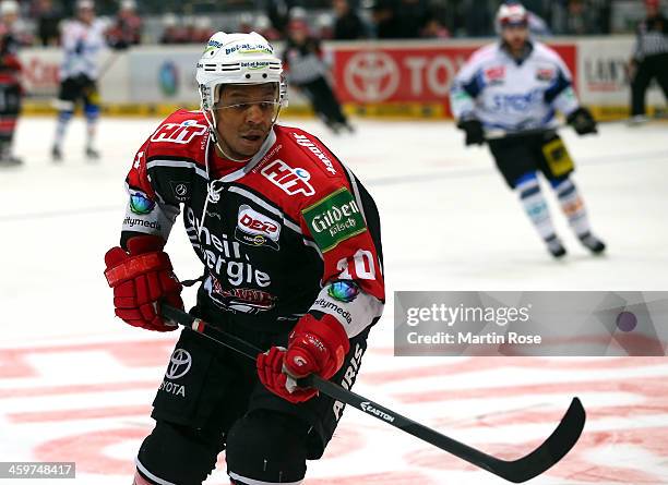 Nathan Robinson of Koeln skates against the Schwenninger Wild Wings puck during the DEL match between Koelner Haie and Schwenninger Wild Wings at...