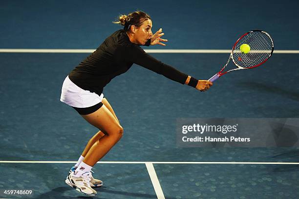 Marina Erakovic of New Zealand plays a backhand during her doubles match with partner Cara Black of Zimbabwe against Abigail Guthrie of New Zealand...