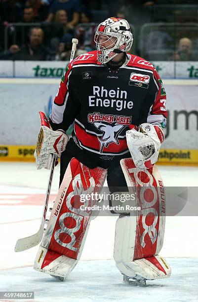 Youri Ziffzer, goaltender of Koeln skates against the Schwenninger Wild Wings puck during the DEL match between Koelner Haie and Schwenninger Wild...