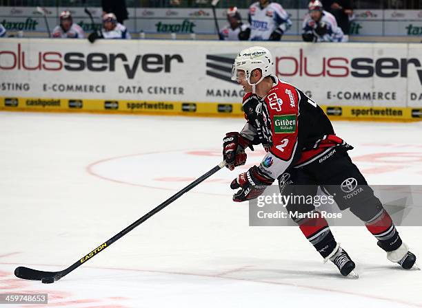 Mirko Luedemann of Koeln skates against the Schwenninger Wild Wings puck during the DEL match between Koelner Haie and Schwenninger Wild Wings at...