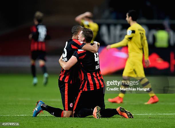 Bamba Anderson of Eintracht Frankfurt and team mate Marco Russ celebrate as Haris Seferovic scores their second goal during the Bundesliga match...