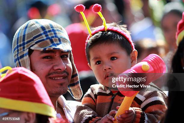 Boy holds a squeaky mallet during the memorial service for the late Mexican comedian, screenwriter, TV producer, actor and director Roberto Gomez...