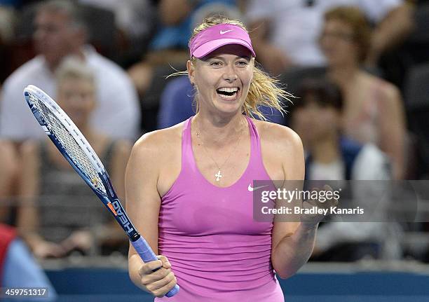 Maria Sharapova of Russia celebrates victory after winning her match against Caroline Garcia of France during day two of the 2014 Brisbane...