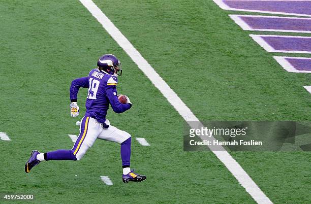 Adam Thielen of the Minnesota Vikings carries the ball to the end zone against the Carolina Panthers during the first quarter of the game on November...