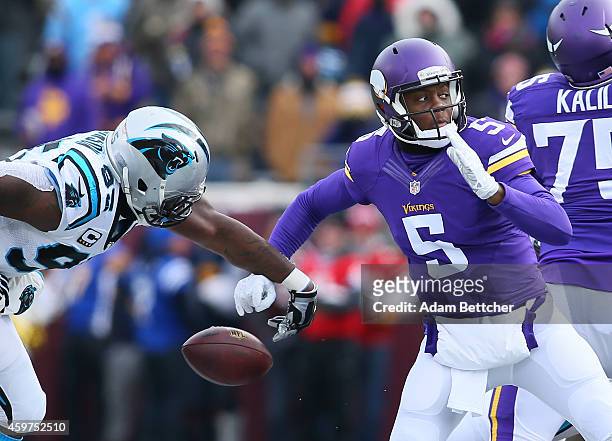 Charles Johnson of the Carolina Panthers gets his hand on the ball forcing a fumble that Teddy Bridgewater of the Minnesota Vikings recovered in the...