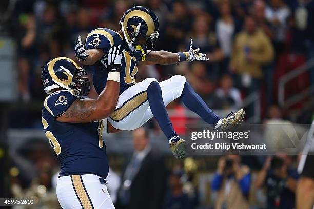 Rodger Saffold and Tavon Austin of the St. Louis Rams celebrate Austin's first quarter touchdown against the Oakland Raiders at the Edward Jones Dome...