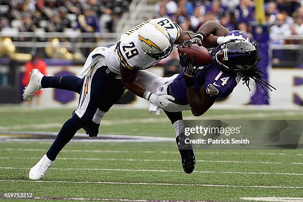 Wide receiver Marlon Brown of the Baltimore Ravens makes a second quarter catch against the defense of cornerback Shareece Wright of the San Diego...