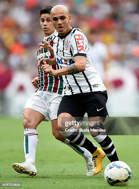 Conca of Fluminense struggles for the ball with a Fabio Santos of Corinthians during a match between Fluminense and Corinthians as part of...