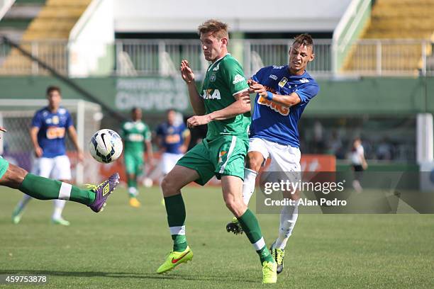 Neilton of Cruzeiro struggles for the ball with a Fabiano of Chapecoense during a match between Chapecoense and Cruzeiro for the Brazilian Series A...