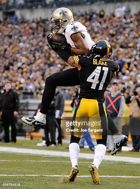 Marques Colston of the New Orleans Saints makes a touchdown catch in front of Antwon Blake of the Pittsburgh Steelers during the fourth quarter at...