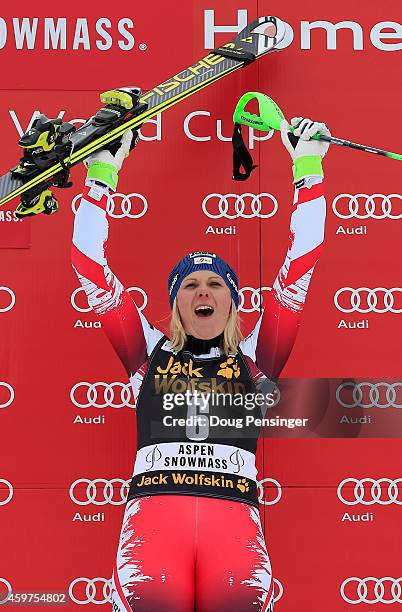 Nicole Hosp of Austria celebrates on the podium after winning the ladies slalom at the 2014 Audi FIS Ski World Cup at the Nature Valley Aspen...