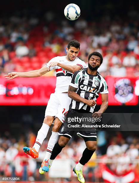 Alan Kardec of Sao Paulo and Nirley of Figueirense in action during the match between Sao Paulo and Figueirense for the Brazilian Series A 2014 at...
