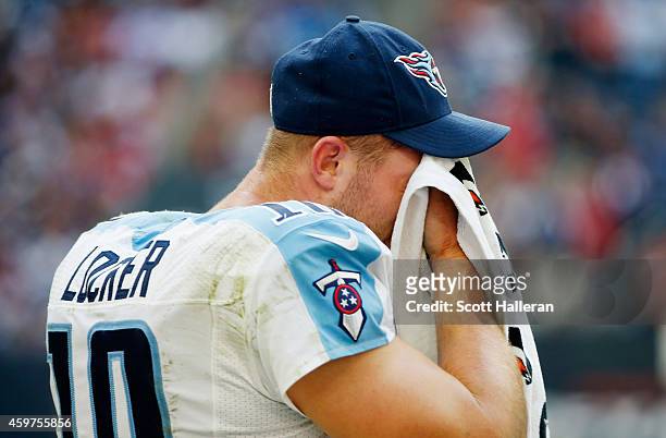 Jake Locker of the Tennessee Titans waits on the sidelines in the second half of their game against the Houston Texans at NRG Stadium on November 30,...