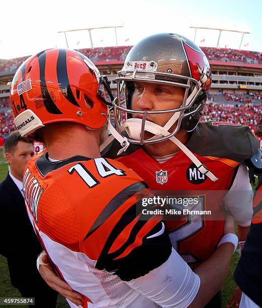 Josh McCown of the Tampa Bay Buccaneers and Andy Dalton of the Cincinnati Bengals shake hands after a game at Raymond James Stadium on November 30,...