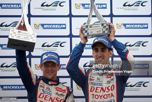 Sebastien Buemi of Switzerland and Anthony Davidson of Great Britain drives Toyota Racing Toyota TS040 Hybrid LMP1 celebrates the second place on the...