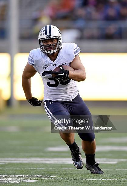 Paul Lasike of the Brigham Young Cougars carries the ball against the California Golden Bears at California Memorial Stadium on November 29, 2014 in...