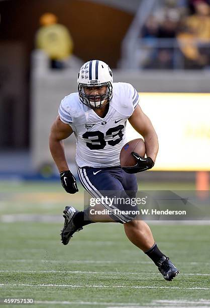 Paul Lasike of the Brigham Young Cougars carries the ball against the California Golden Bears at California Memorial Stadium on November 29, 2014 in...