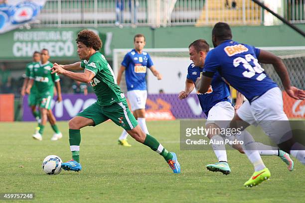 Willian Farias of Cruzeiro moves the ball against Camilo of Chapecoense during a match between Chapecoense and Cruzeiro for the Brazilian Series A...