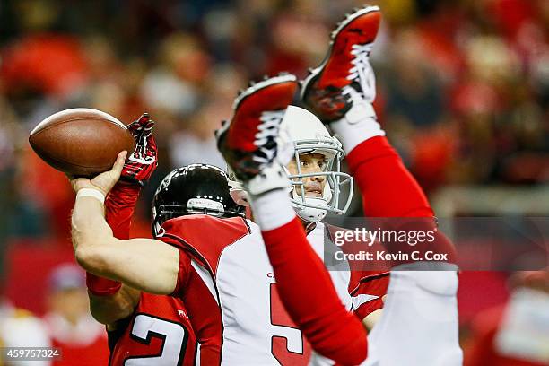 Drew Stanton of the Arizona Cardinals throws a pass during the first half against the Atlanta Falcons at the Georgia Dome on November 30, 2014 in...