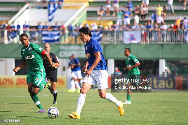 Marcelo Moreno of Cruzeiro struggles for the ball with a Rafael Lima of Chapecoense during a match between Chapecoense and Cruzeiro for the Brazilian...